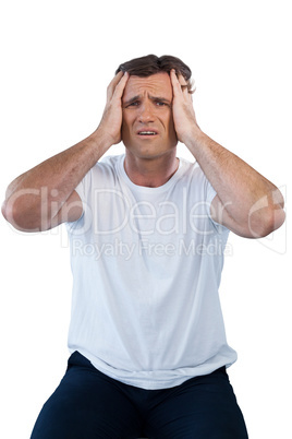 Frustrated mature man with head in hand