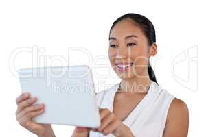 Close up of happy young businesswoman using tablet computer