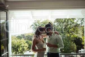 Couple embracing each other while having champagne