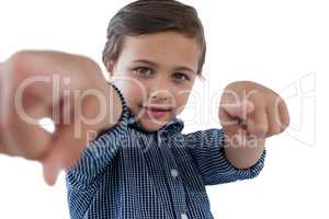Portrait of boy pointing finger