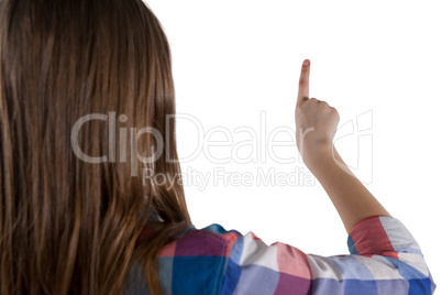 Girl pressing an invisible virtual screen against white background