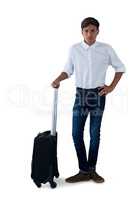Boy posing with a suitcase