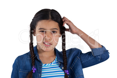 Teenage girl standing against white background