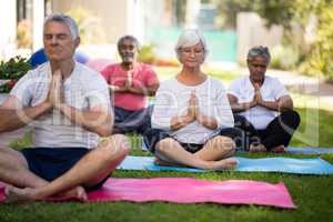 Senior peoplemeditating in prayer position