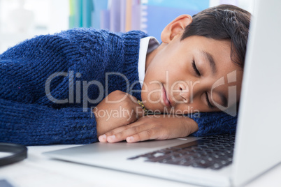 Close up of businessman sleeping on laptop