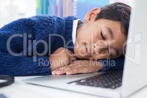 Close up of businessman sleeping on laptop