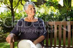 Senior woman sitting on a bench