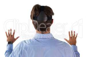 Rear view of businessman wearing vr glasses