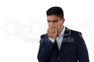 Worried businessman biting nails