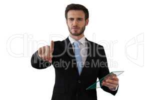 Man touching invisible screen while holding glass interface