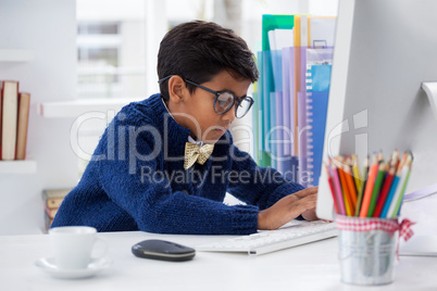 Businessman using desktop computer