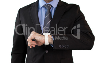 Mid section of businessman wearing smart watch