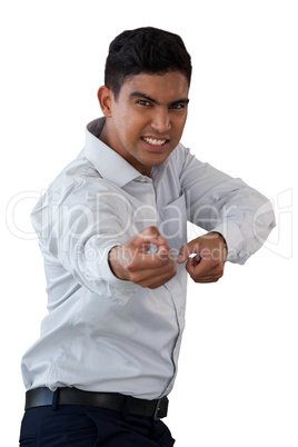 Portrait of businessman pulling invisible rope