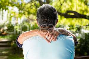 Senior couple dancing in the garden