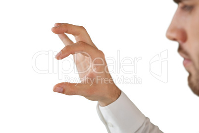 Cropped image of businessman looking at invisible product