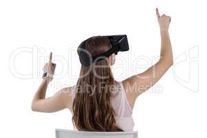 Teenage girl using virtual reality headset