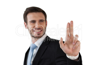 Happy businessman touching invisible screen