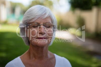 Senior woman with closed eyes