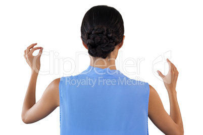 Rear view of businesswoman gesturing