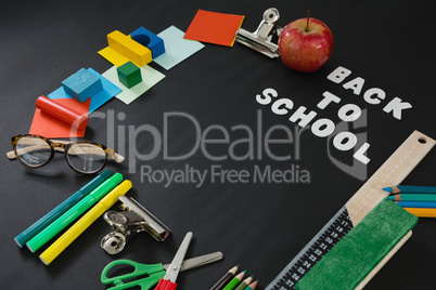 School supplies with text arranged on black background
