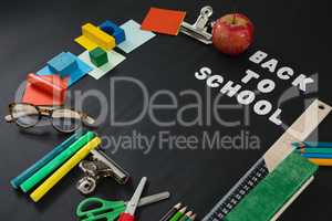 School supplies with text arranged on black background