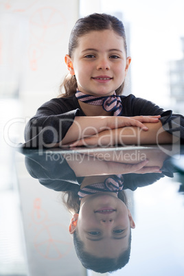 Close up portrait of smiling businesswoman at desk