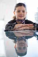 Close up portrait of smiling businesswoman at desk