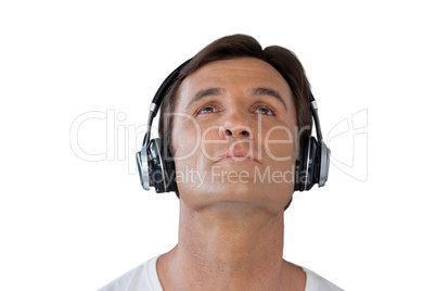 Thoughtful mature man wearing headphones