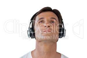 Thoughtful mature man wearing headphones