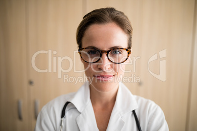 Close-up of smiling female practitioner wearing eyeglasses