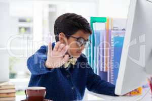 Businessman showing hand while working in office