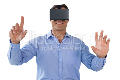 Smiling businessman using vr glasses