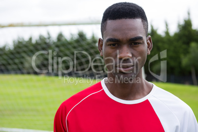 Portrait of serioud confident male soccer player