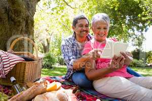 Senior couple using digital tablet