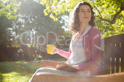 Thoughtful woman having a cup of coffee