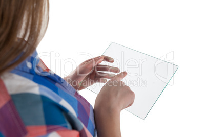 Girl using a glass digital tablet against white background