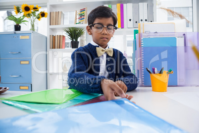 Businessman wearing eyeglasses working at desk