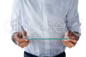 Teenage boy holding a glass digital tablet