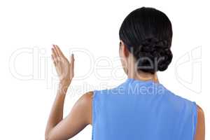 Rear view of businesswoman with hair bun using invisible interface
