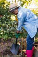 Senior woman gardening at the park