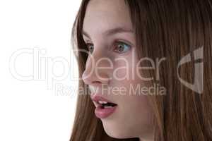 Surprised teenage girl against white background