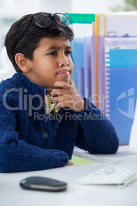 Close up of confused businessman looking at computer monitor