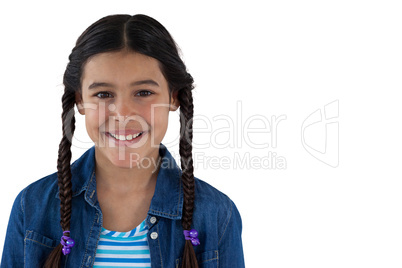 Smiling cute girl standing against white background