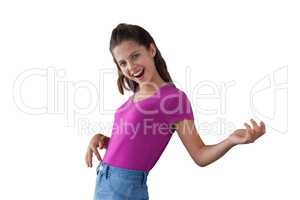 Smiling girl dancing against white background