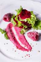 Carpaccio of baked red pray with green salad and raspberry