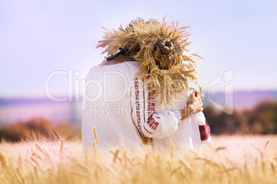 Mom and daughter in the wheat field