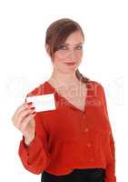 Woman holding a business card up.