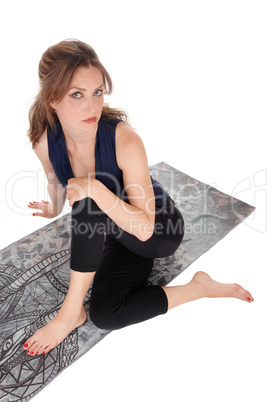 Woman sitting on floor and looking up.