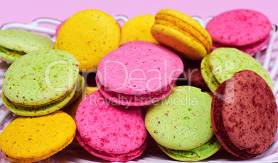 Multicolored macaroons in a plate,
