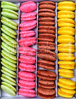 Multicolored macaroons in a paper box